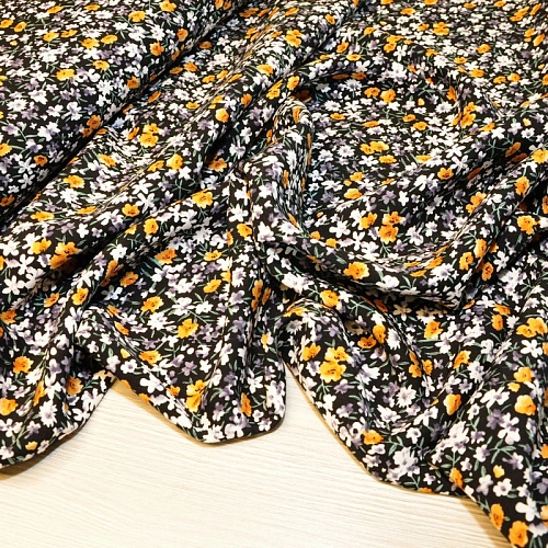Штапель принт "Оранжевые цветочки на черном фоне"