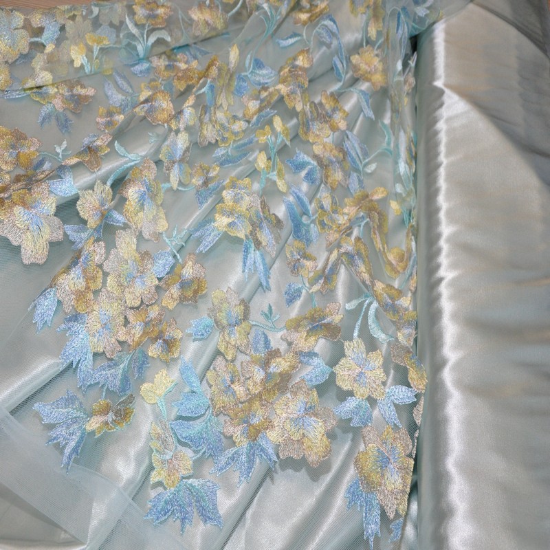 Вышивка на сетке (голубой+желтый) скидки на ткани в Минске оптом и в розницу | Трикотаж tais.by