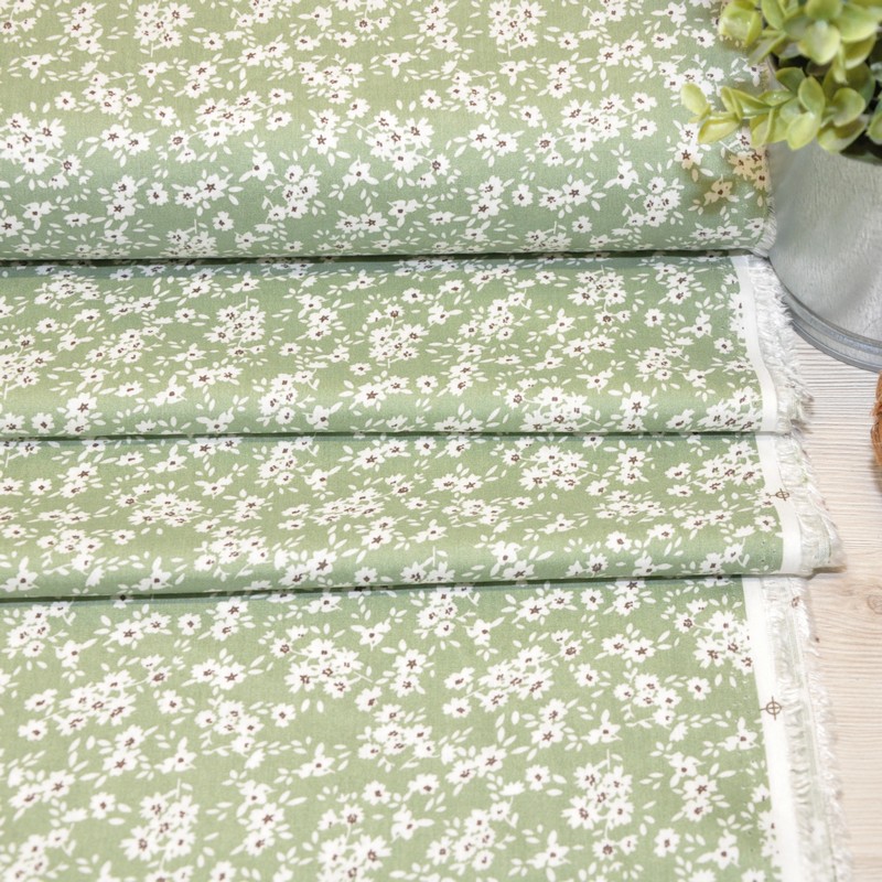 Штапель принт полянка  на фоне фисташка